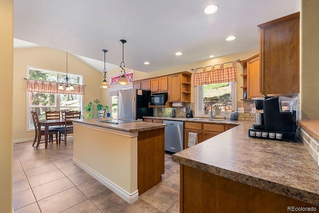 1563 Southpark Rd, Florissant, CO 80816 - kitchen with open shelves, black appliances, a center island, light tile patterned floors, and backsplash