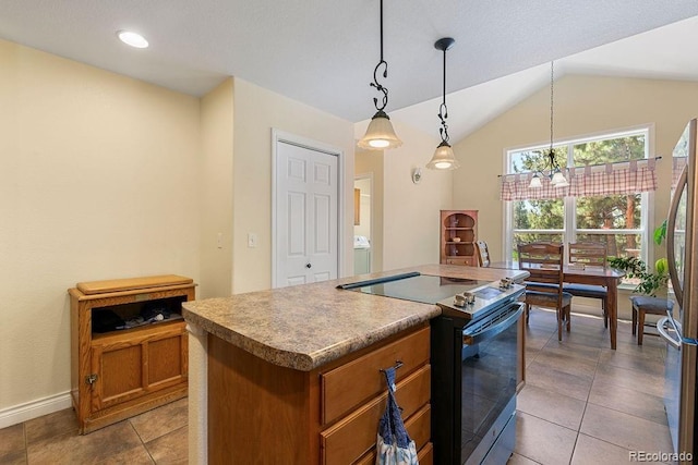 1563 Southpark Rd, Florissant, CO 80816 - kitchen featuring range with electric cooktop, brown cabinetry, a chandelier, a kitchen island, and washer / clothes dryer