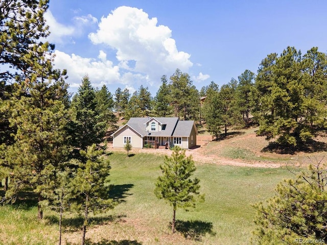 1563 Southpark Rd, Florissant, CO 80816 - view of front facade with a front yard and covered porch