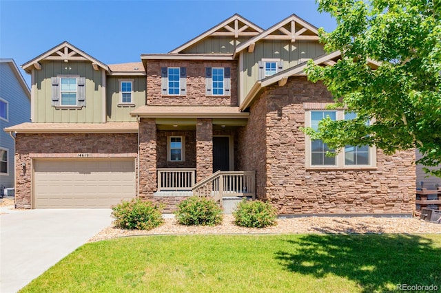 craftsman-style house featuring a garage and a front yard