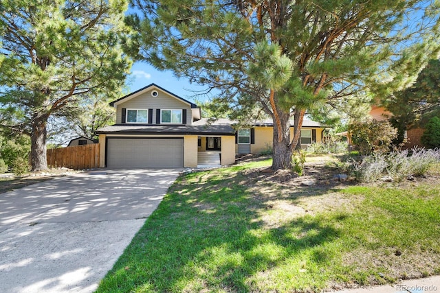 view of front facade with a front lawn and a garage