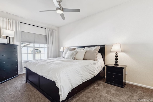 bedroom with ceiling fan and dark colored carpet