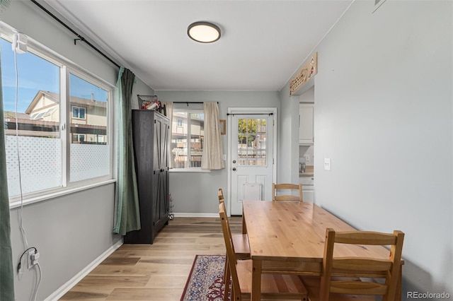 dining area with light wood-type flooring