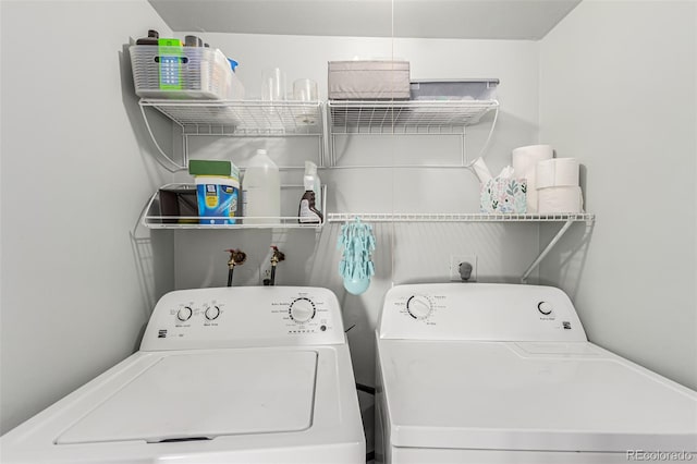 laundry room with washing machine and dryer