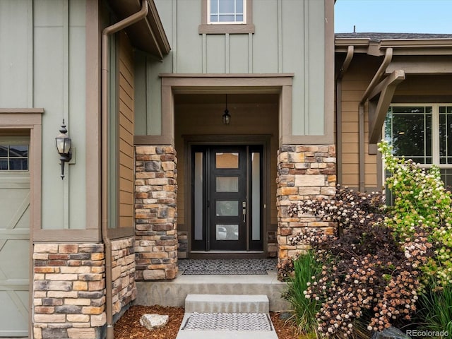 2113 Fountain Cir, Erie, CO 80516 - doorway to property with stone siding and board and batten siding