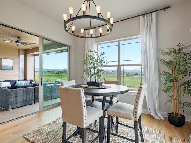 2113 Fountain Cir, Erie, CO 80516 - dining space featuring a chandelier, light wood-style flooring, and a ceiling fan