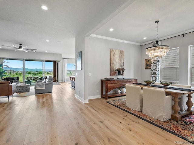 2113 Fountain Cir, Erie, CO 80516 - dining room featuring a ceiling fan, baseboards, recessed lighting, light wood-style floors, and a chandelier