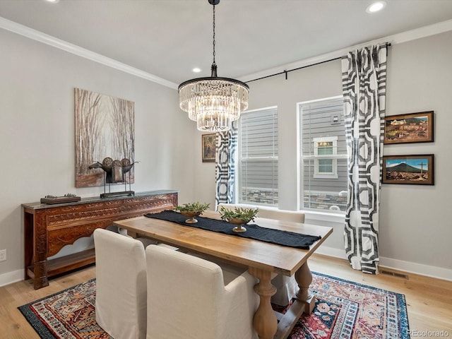 2113 Fountain Cir, Erie, CO 80516 - dining space featuring ornamental molding, a chandelier, recessed lighting, light wood-type flooring, and baseboards