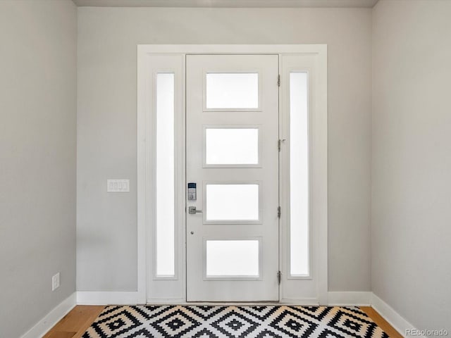 2113 Fountain Cir, Erie, CO 80516 - foyer entrance with baseboards and light wood-style flooring