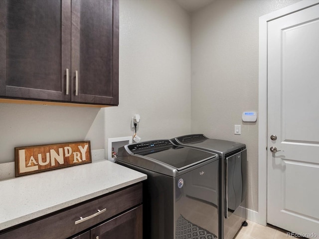2113 Fountain Cir, Erie, CO 80516 - laundry area featuring cabinet space, separate washer and dryer, and light tile patterned floors