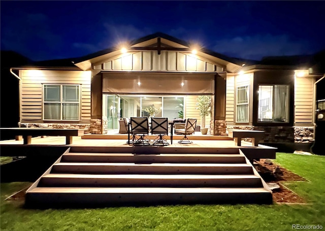 2113 Fountain Cir, Erie, CO 80516 - back of house at twilight with stone siding and board and batten siding