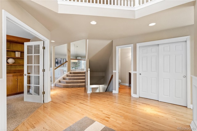 entryway with french doors and hardwood / wood-style flooring