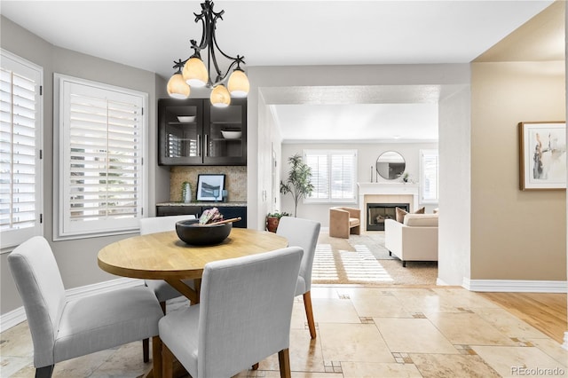 dining area with an inviting chandelier