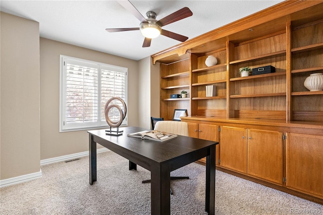 office area featuring ceiling fan and light colored carpet