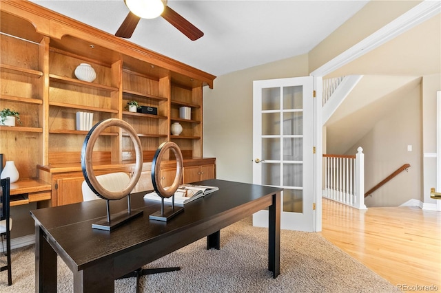 home office featuring light hardwood / wood-style flooring and vaulted ceiling