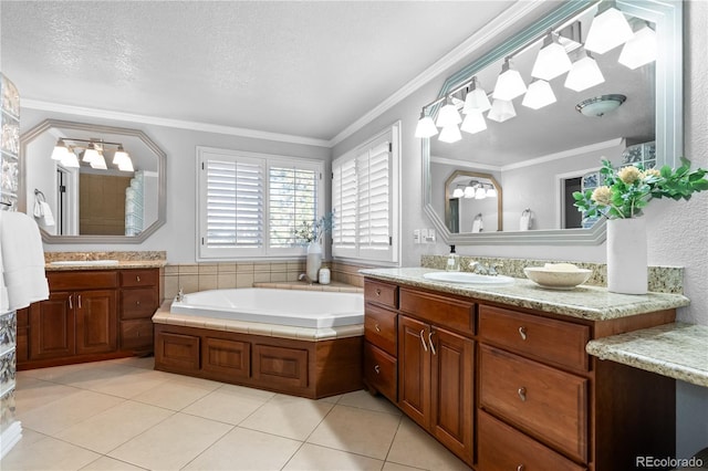 bathroom with vanity, a textured ceiling, tile patterned floors, and crown molding