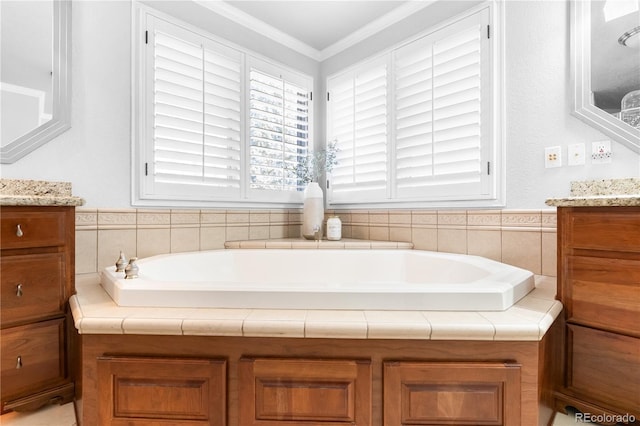 bathroom with vanity, ornamental molding, and a bath