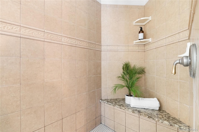 bathroom with a tile shower