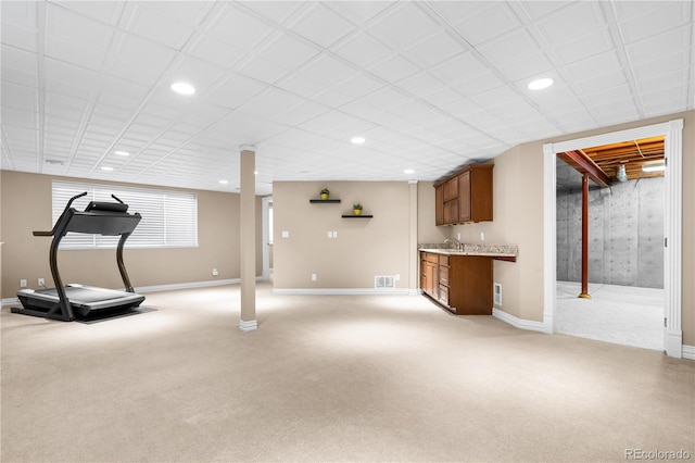 exercise room with light carpet