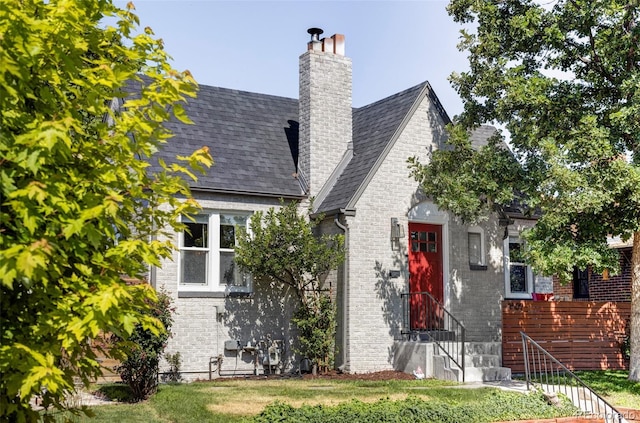 3509 N Monroe St, Denver, CO 80205 - view of front of home featuring a chimney and brick siding