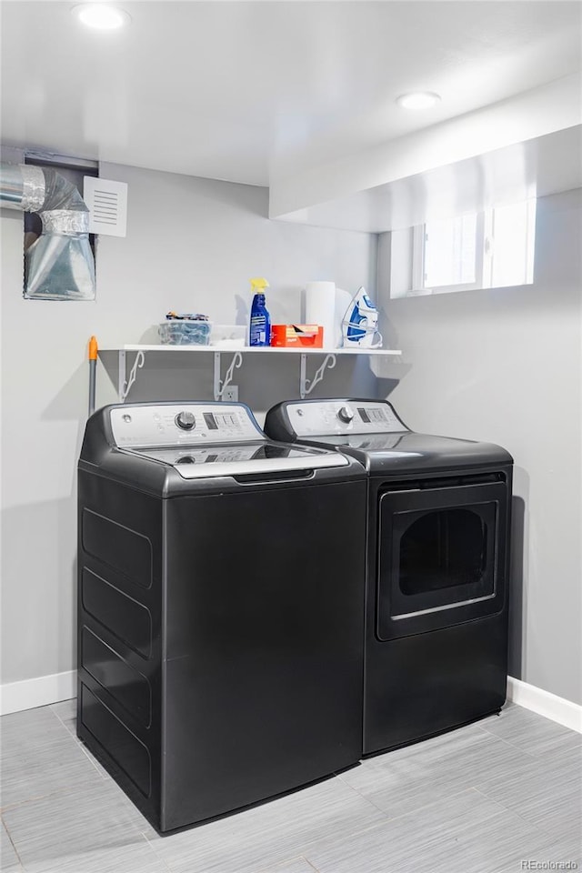 3509 N Monroe St, Denver, CO 80205 - laundry room with baseboards and washing machine and clothes dryer