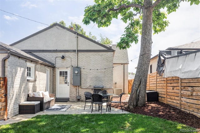 3509 N Monroe St, Denver, CO 80205 - rear view of property with brick siding, a patio area, and roof with shingles