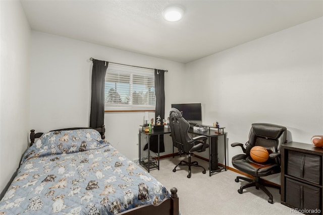 carpeted bedroom featuring baseboards