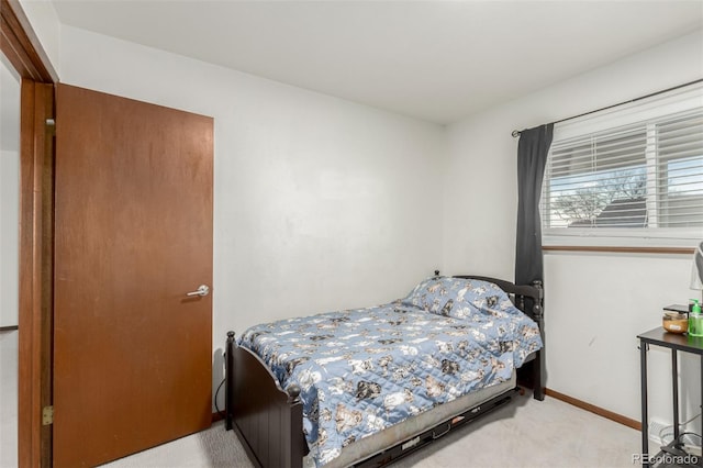 bedroom featuring light colored carpet