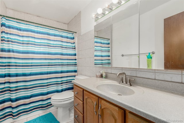 bathroom featuring toilet, a shower with shower curtain, vanity, tile walls, and backsplash