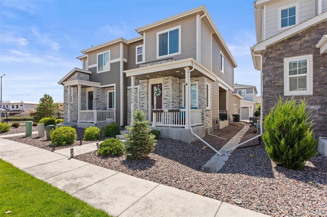 23534 E 5th Pl, Aurora, CO 80018 - view of front facade with covered porch and stone siding