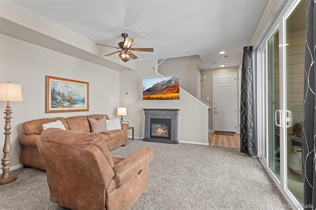 23534 E 5th Pl, Aurora, CO 80018 - carpeted living room with ceiling fan, recessed lighting, and a glass covered fireplace