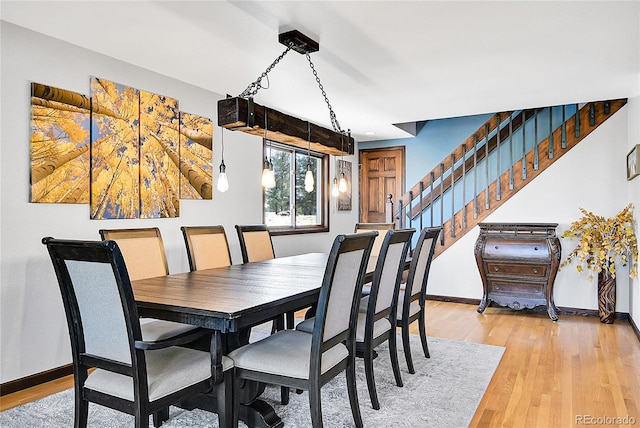 1567 Tapadero Rd, Bailey, CO 80421 - dining space featuring stairs and light wood-style floors