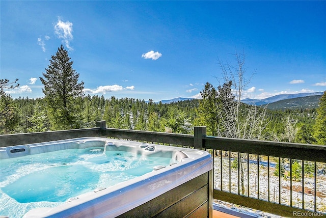 1567 Tapadero Rd, Bailey, CO 80421 - balcony featuring a hot tub, a view of trees, and a mountain view