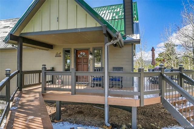 1567 Tapadero Rd, Bailey, CO 80421 - rear view of house featuring board and batten siding, a deck, and a chimney