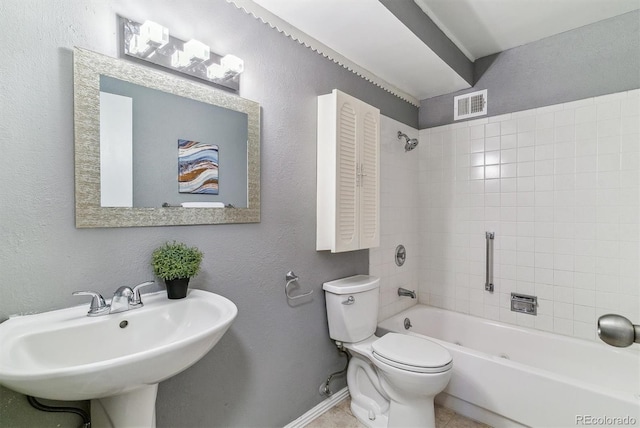 13626 E Bates Ave Unit 110, Aurora, CO 80014 - bathroom with  shower combination, a sink, baseboards, toilet, and a textured wall