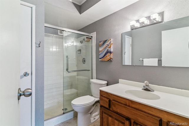 13626 E Bates Ave Unit 110, Aurora, CO 80014 - full bath with a stall shower, toilet, vanity, and a textured wall