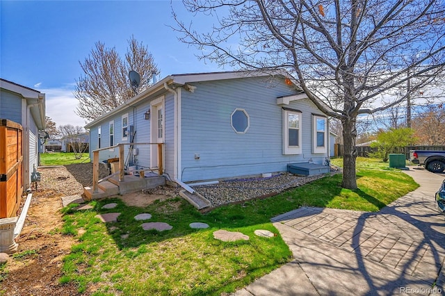6631 E 78th Ave, Commerce City, CO 80022 - view of side of property with a yard