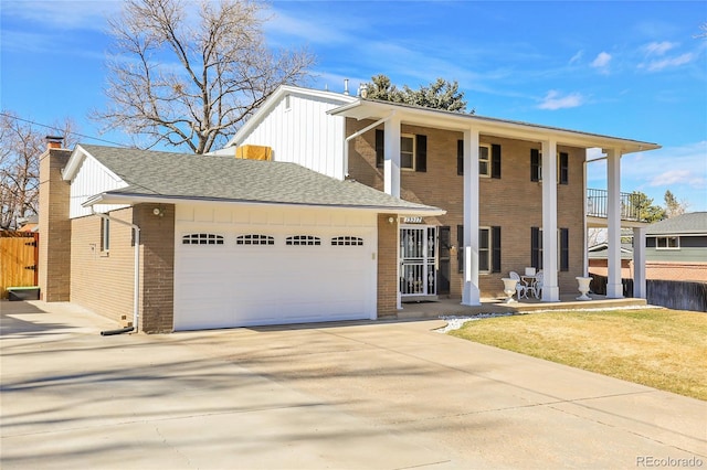 view of front facade featuring board and batten siding, concrete driveway, brick siding, and an attached garage