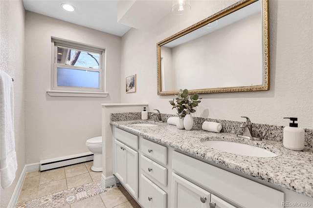 bathroom with tile patterned flooring, a baseboard radiator, a sink, and toilet