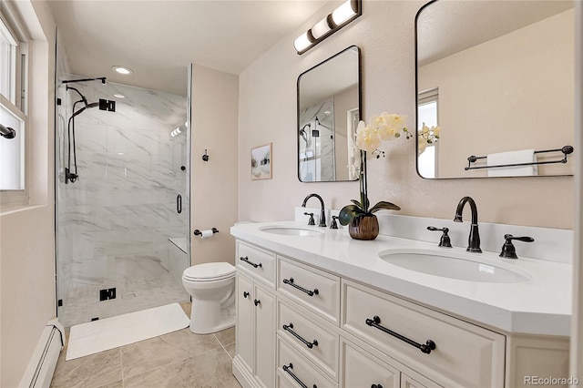 bathroom with toilet, a marble finish shower, a baseboard heating unit, and a sink