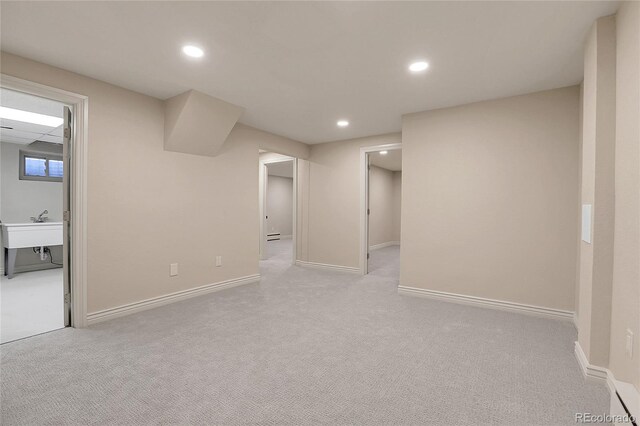 finished below grade area featuring baseboards, carpet floors, and recessed lighting