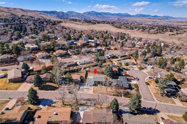 birds eye view of property with a residential view and a mountain view