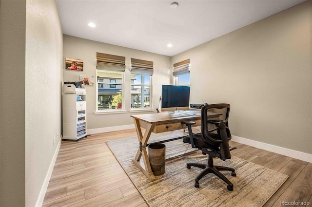 office with light hardwood / wood-style floors