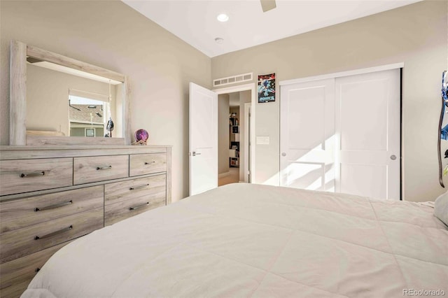 bedroom featuring a closet, lofted ceiling, and ceiling fan