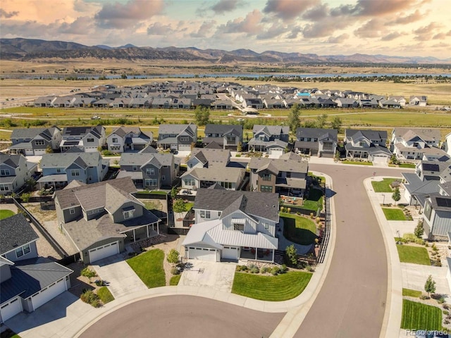 drone / aerial view with a mountain view and a residential view