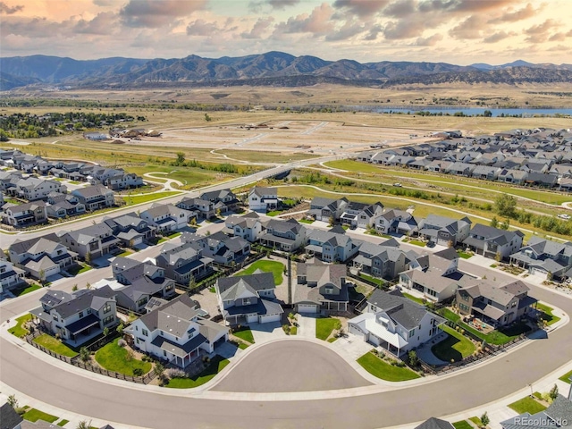 drone / aerial view featuring a residential view and a mountain view