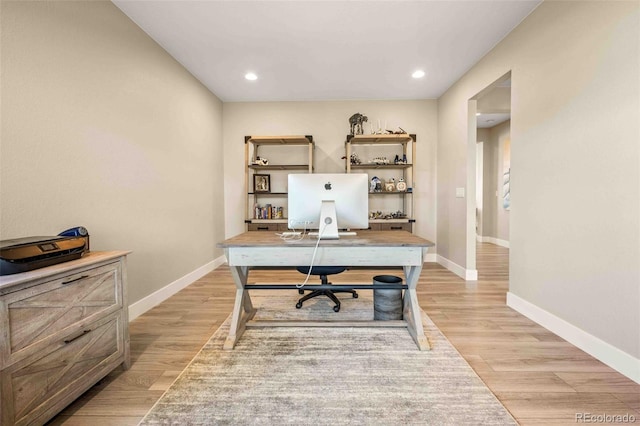 office with baseboards, recessed lighting, and light wood-style floors