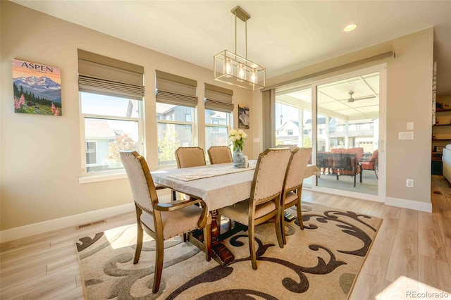 dining area with light wood finished floors, recessed lighting, visible vents, and baseboards