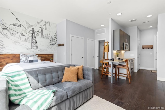 2550 Lawrence St Unit Rb306, Denver, CO 80205 - living room featuring dark wood finished floors and recessed lighting