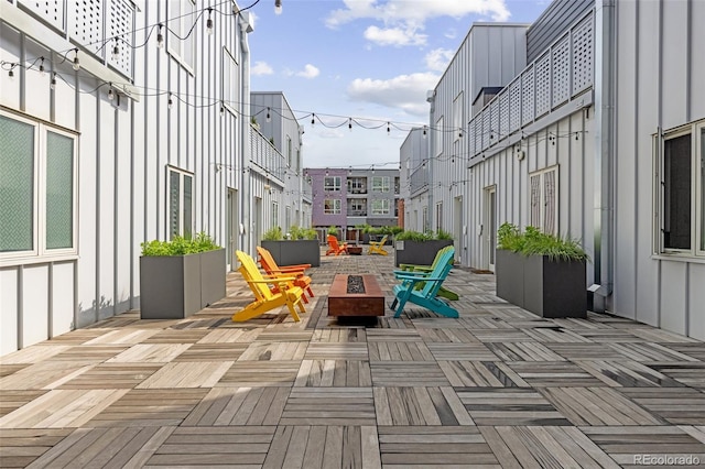 2550 Lawrence St Unit Rb306, Denver, CO 80205 - view of patio / terrace with an outdoor fire pit and a wooden deck
